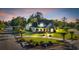 Beautiful traditional home with manicured lawn, lovely landscaping, and circular driveway at 107 Long Bay Golf Pl., Longs, SC 29568