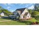 Charming traditional home with stone accents, covered porch and nicely landscaped yard at 107 Long Bay Golf Pl., Longs, SC 29568