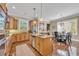 Open kitchen with stainless appliances, central island, and attached breakfast nook at 107 Long Bay Golf Pl., Longs, SC 29568
