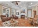 Cozy living room with fireplace, built-in shelving, and comfortable armchairs at 107 Long Bay Golf Pl., Longs, SC 29568