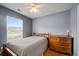 A serene bedroom provides natural light from the window and features a ceiling fan at 1117 Jumper Trail Circle, Myrtle Beach, SC 29588