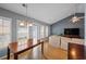 Open-concept dining area adjacent to the living room with hardwood floors and a chandelier at 1117 Jumper Trail Circle, Myrtle Beach, SC 29588
