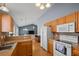 Well-lit kitchen with light wood cabinets and backsplash, open to the living room for easy entertaining at 1117 Jumper Trail Circle, Myrtle Beach, SC 29588