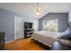 Serene main bedroom with vaulted ceiling, wood floors, and ample natural light at 1117 Jumper Trail Circle, Myrtle Beach, SC 29588