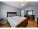 Comfortable main bedroom featuring a large bed, wood floors, and a classic dresser at 1117 Jumper Trail Circle, Myrtle Beach, SC 29588