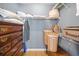 Walk-in closet features wooden drawers and shelves for ample storage solutions and easy organization at 1117 Jumper Trail Circle, Myrtle Beach, SC 29588