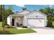 Charming one-story home with a one-car garage, covered front porch, and a well-maintained lawn at 1154 Silver Perch Place, Sunset Beach, NC 28468