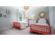 Bright bedroom featuring twin beds, light walls, straw decor, and natural light from a window at 1166 Silver Perch Place, Sunset Beach, NC 28468