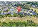 Aerial view showcasing the neighborhood's scenic ponds and golf course views at 120 Whitemarsh Ct., Murrells Inlet, SC 29576