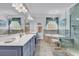 Spacious bathroom with a double vanity, soaking tub, glass shower, and recessed lighting at 120 Whitemarsh Ct., Murrells Inlet, SC 29576