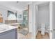 Bright bathroom featuring a soaking tub, glass shower, and a separate toilet area at 120 Whitemarsh Ct., Murrells Inlet, SC 29576