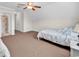 Bedroom featuring neutral carpet, sloped ceilings, and access to an ensuite bathroom at 120 Whitemarsh Ct., Murrells Inlet, SC 29576