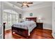 Bedroom featuring hardwood floors, a ceiling fan, and plenty of natural light at 120 Whitemarsh Ct., Murrells Inlet, SC 29576