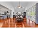 Bright dining room with hardwood floors, tray ceiling, and access to an outdoor patio at 120 Whitemarsh Ct., Murrells Inlet, SC 29576