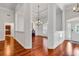 Elegant foyer boasts hardwood floors, wainscoting, and a decorative chandelier at 120 Whitemarsh Ct., Murrells Inlet, SC 29576