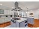 Spacious kitchen featuring dual islands, stainless steel appliances, and a modern range hood at 120 Whitemarsh Ct., Murrells Inlet, SC 29576