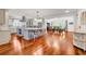 Open-concept kitchen featuring a large island, modern appliances, and hardwood floors at 120 Whitemarsh Ct., Murrells Inlet, SC 29576
