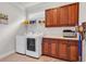 Functional laundry room featuring built-in cabinets, countertop space, and modern washer/dryer at 120 Whitemarsh Ct., Murrells Inlet, SC 29576