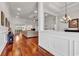 Spacious living room featuring hardwood floors, a large sectional, and bright, natural lighting at 120 Whitemarsh Ct., Murrells Inlet, SC 29576