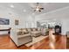 Bright living room with hardwood floors, a comfortable sectional, and an open layout at 120 Whitemarsh Ct., Murrells Inlet, SC 29576