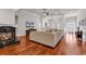 Cozy living room with a fireplace, hardwood floors, and a large sectional sofa at 120 Whitemarsh Ct., Murrells Inlet, SC 29576