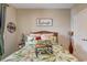 Comfortable bedroom featuring tropical bedding, natural light, and stylish decor at 128 Puffin Dr. # 1-E, Pawleys Island, SC 29585