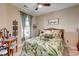 Inviting bedroom with tropical themed bedding, natural light, and stylish decor at 128 Puffin Dr. # 1-E, Pawleys Island, SC 29585