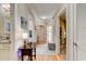 Hallway view showcasing hardwood floors, neutral paint, and the opening to several rooms at 128 Puffin Dr. # 1-E, Pawleys Island, SC 29585