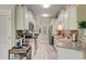 Galley kitchen with granite countertops, mosaic backsplash, and stainless steel appliances at 128 Puffin Dr. # 1-E, Pawleys Island, SC 29585