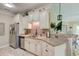 Cozy kitchen featuring granite countertops, stainless steel appliances, and ample cabinet space at 128 Puffin Dr. # 1-E, Pawleys Island, SC 29585