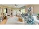 Comfortable living room featuring a ceiling fan, hardwood floors, and plenty of natural light at 128 Puffin Dr. # 1-E, Pawleys Island, SC 29585