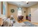 Bright home office featuring neutral tones, hardwood floors, and cozy seating area at 128 Puffin Dr. # 1-E, Pawleys Island, SC 29585