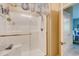 This spacious shower features a glass door, handheld sprayer and ample space at 128 Puffin Dr. # 1-E, Pawleys Island, SC 29585