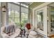 Cozy sunroom featuring a view of the backyard and comfortable seating at 128 Puffin Dr. # 1-E, Pawleys Island, SC 29585