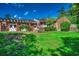 Expansive backyard with a pergola, manicured lawn, and mature landscaping, great for entertaining at 141 N Gate Rd., Myrtle Beach, SC 29572