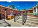 Backyard with a hot tub and outdoor seating featuring brick and green landscaping at 141 N Gate Rd., Myrtle Beach, SC 29572