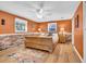 Spacious bedroom with hardwood floors, natural lighting, and exposed brick detail at 141 N Gate Rd., Myrtle Beach, SC 29572