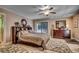 Spacious bedroom with a ceiling fan, a sliding glass door, and dark wood furniture at 141 N Gate Rd., Myrtle Beach, SC 29572