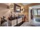 Foyer featuring a decorative mirror, lamps, console table, and stylish decor, with hardwood-style flooring at 141 N Gate Rd., Myrtle Beach, SC 29572