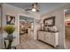 Hallway featuring decor, leading to another room, with a ceiling fan and neutral color scheme at 141 N Gate Rd., Myrtle Beach, SC 29572