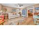Cozy living room with hardwood floors, sofa, and a unique display cabinet at 141 N Gate Rd., Myrtle Beach, SC 29572