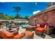 Beautiful patio featuring a fire pit, with a view of the pool and neighboring house at 141 N Gate Rd., Myrtle Beach, SC 29572