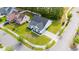 Aerial view of a beautifully landscaped home with a black roof and a manicured lawn at 1500 Sunmeadow Dr., Conway, SC 29526
