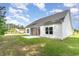Backyard featuring a well-maintained lawn and screened-in porch at 1500 Sunmeadow Dr., Conway, SC 29526
