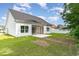 Backyard featuring a well-maintained lawn and screened-in porch at 1500 Sunmeadow Dr., Conway, SC 29526