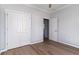 Bedroom with wood-look flooring and white double-door closet at 1500 Sunmeadow Dr., Conway, SC 29526
