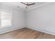 Bedroom with ceiling fan, neutral color scheme, wood floor, and one window at 1500 Sunmeadow Dr., Conway, SC 29526