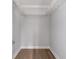 Walk-in closet features simple shelving and wood flooring at 1500 Sunmeadow Dr., Conway, SC 29526