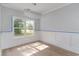 Bright dining area features large window, chandelier lighting, and wood flooring at 1500 Sunmeadow Dr., Conway, SC 29526