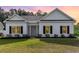 Charming single-story home featuring a manicured lawn, white siding, and black shutters at 1500 Sunmeadow Dr., Conway, SC 29526